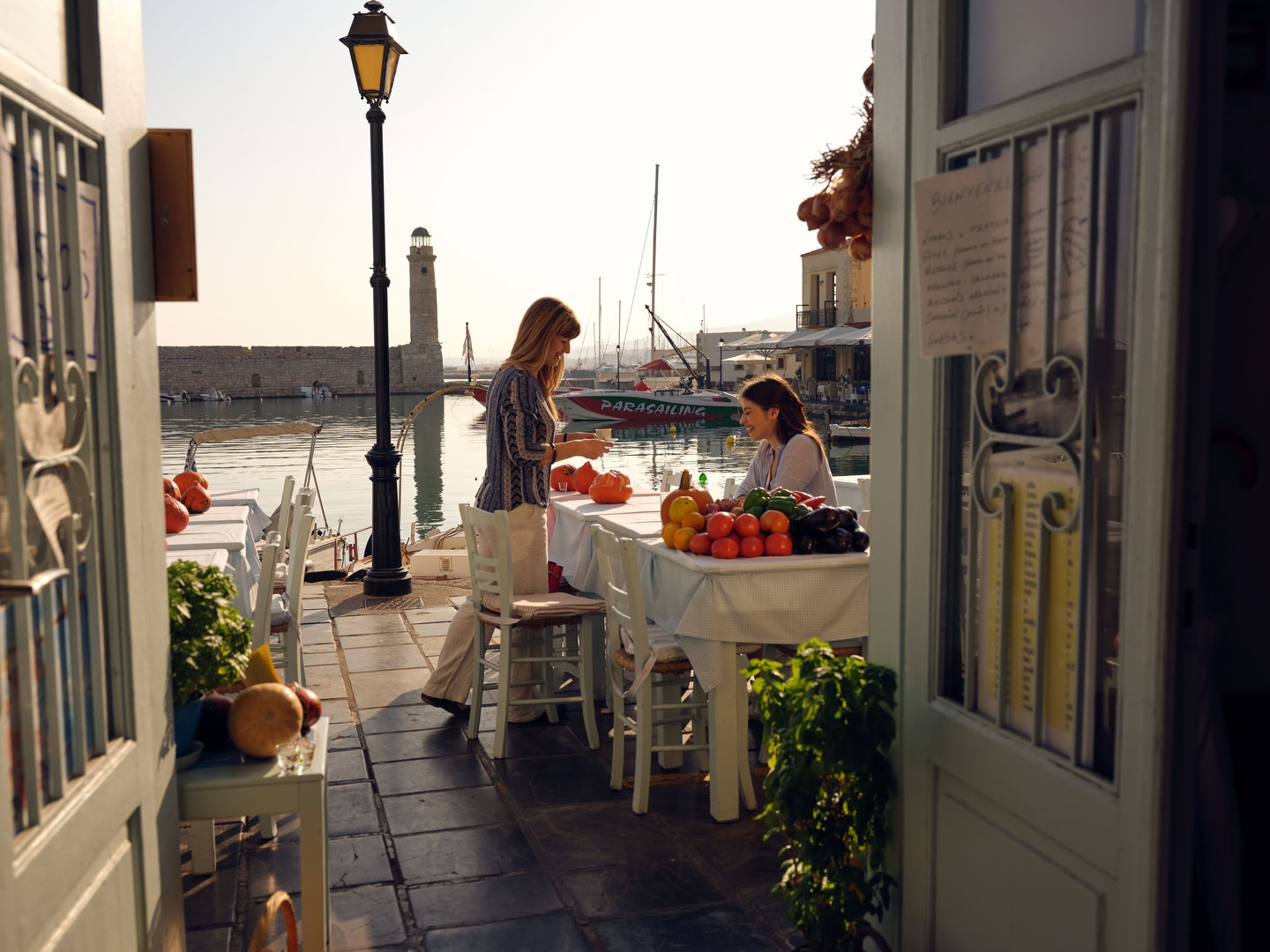 A taverna table by the old harbour of Rethymno
